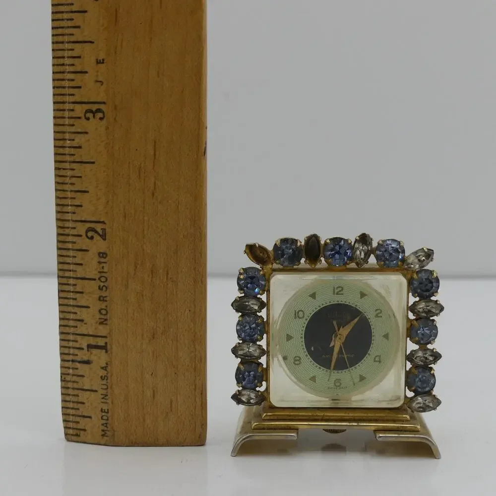 VTG Hilton Jeweled Antimagnetic Mini Skeleton Desk Clock Gold Tone Swiss Quartz